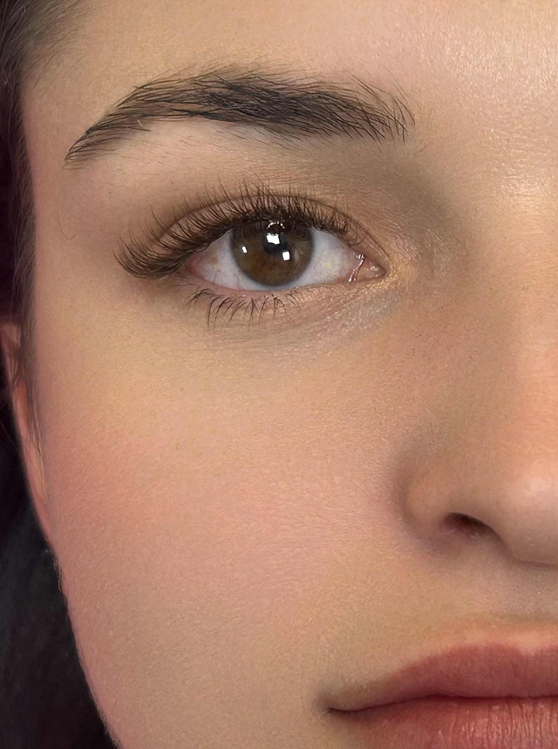 3D Eyelash Extensions with brown lashes.